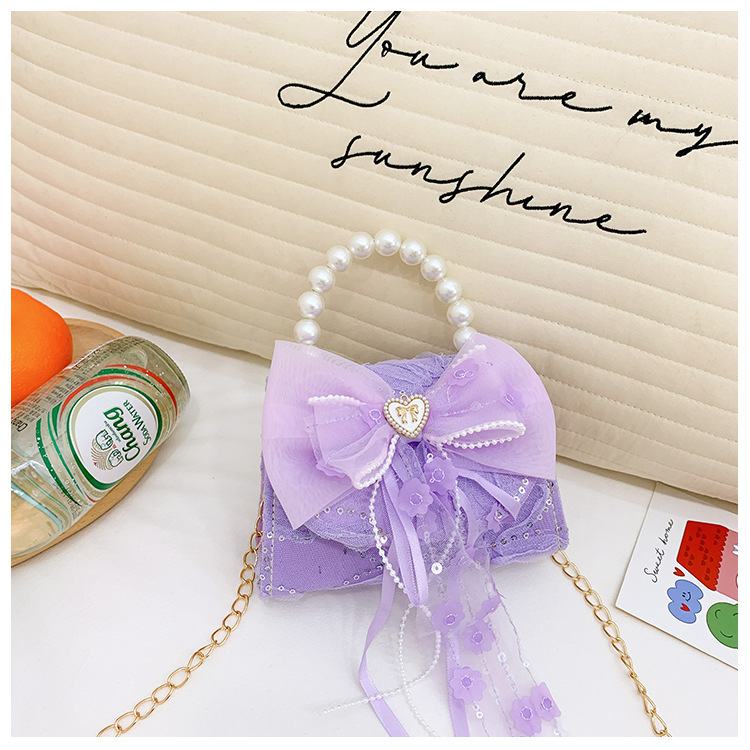 Nuevo bolso de moda para niños bolso de perla animado lindo arco de botón bolso de hombro de niñas cadena diagonal bolso pequeño