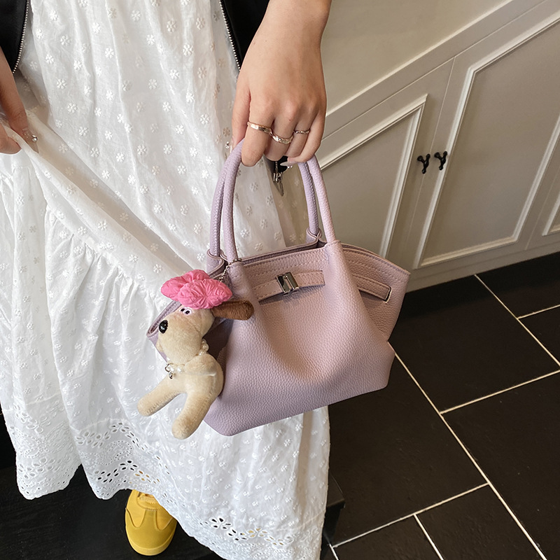 Bolso de cubo de estilo explosivo de moda para mujer, nuevo bolso de hombro de estilo occidental de todo fósforo 2025, bolso de mensajero súper caliente con pliegues de moda