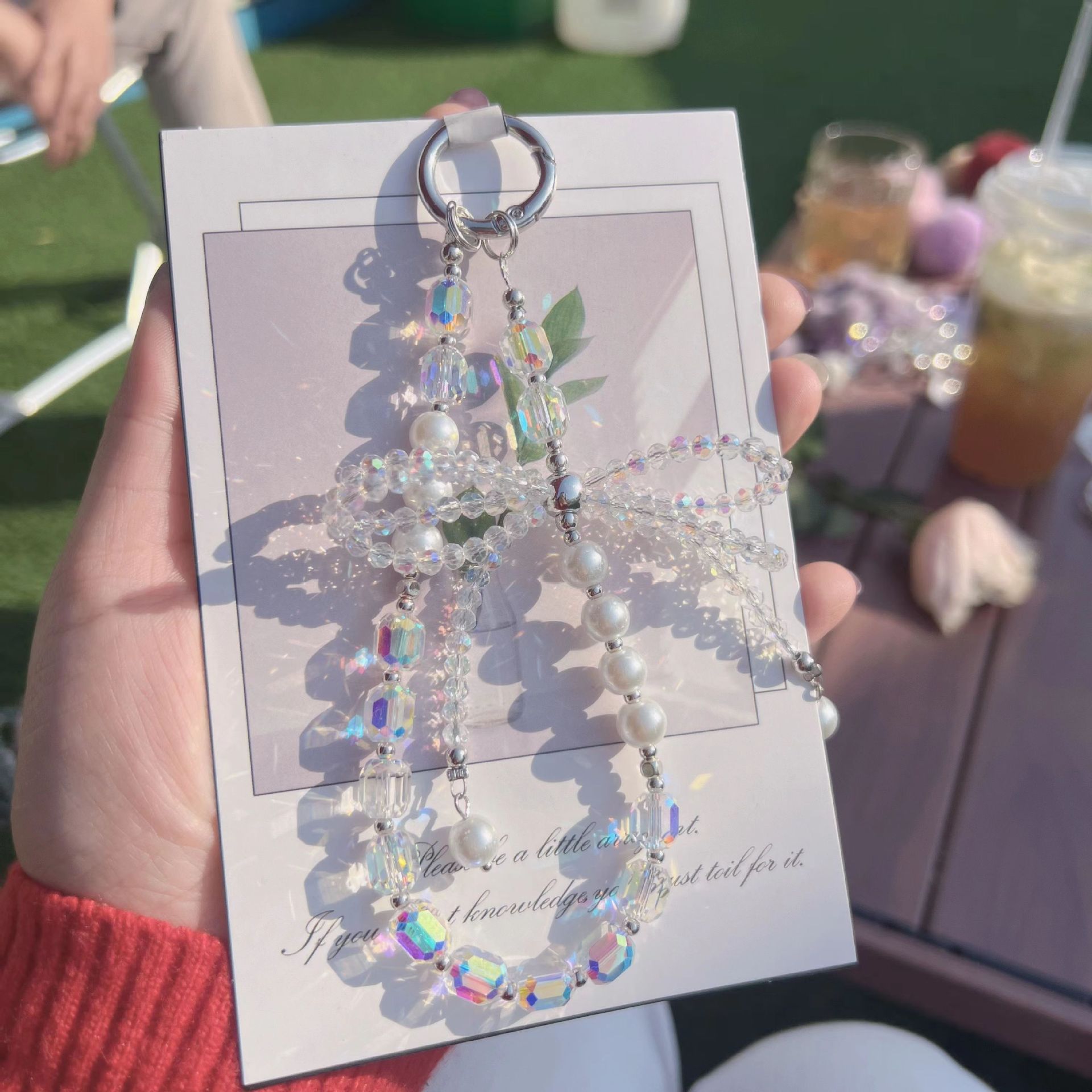 Lazo de perlas de lujo cadena de teléfono móvil cordón de teléfono móvil de alta gama cristal tridimensional corto exquisito cordón de muñeca ins