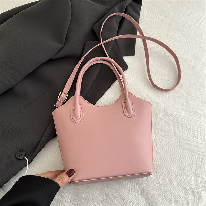 Este año, bolsos populares vintage para mujeres otoño y invierno 025 nuevo bolso de mochila de nicho de diseño de bolso de cubo de viaje portátil