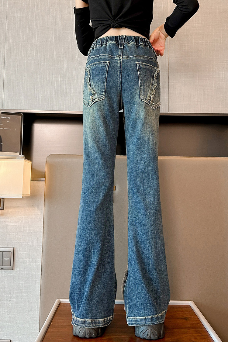 Jeans in denim effetto consumato per bambini con orlo grezzo e vestibilità comoda - Jeans elasticizzati in vita azzurri per ragazze, stile streetwear alla moda_voghion.com