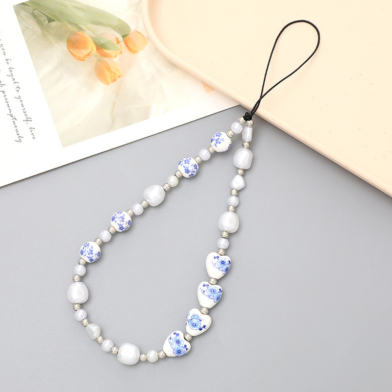 Venta caliente Internet celebridad con cuentas amor teléfono cadena anti-perdida gota resistente teléfono caso diy perla cadena corta teléfono cordón