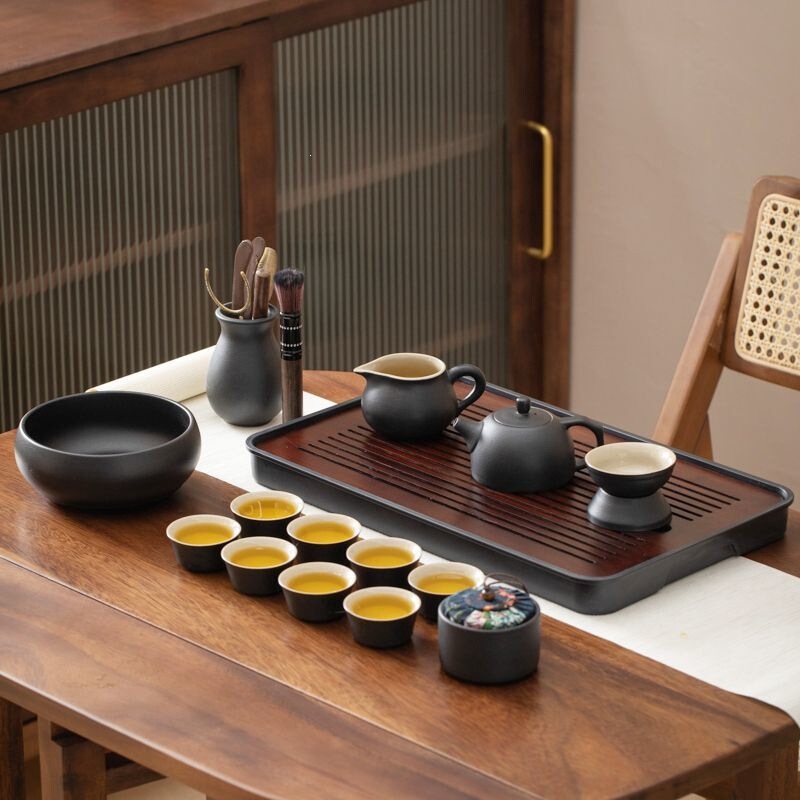 Small tea set with kung fu teacups, Japanese-style simple design for home use, suitable for living room and office, black ceramic teapot with tea tray