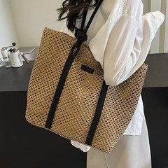 草編みの大きい包みの女性の2025春の夏の新型の控えめで軽い豪華なショルダーバッグの大容量の透かし編みの特包