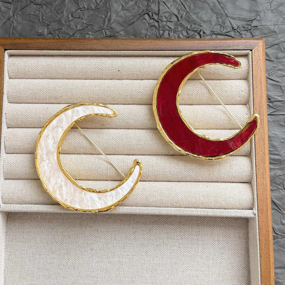 French vintage crescent moon brooch, red and white enamel with metal edges, niche accessory for suit jackets