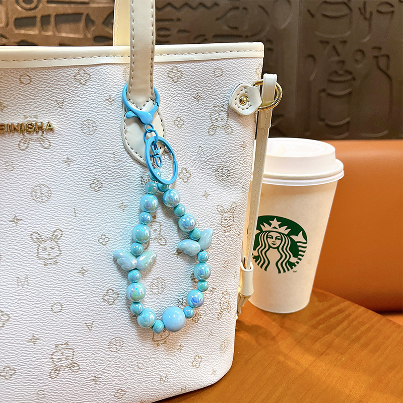 Sala de transmisión directa con alas recuerdos llaveros lindos colgantes de teléfonos móviles accesorios de bolsos llaveros de automóviles al por mayor