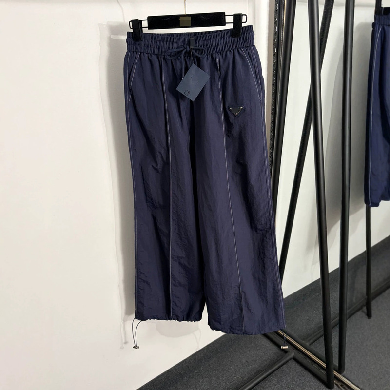 Nanyou High-End Foreign Trade Stylish Slim-Fit Women's New Style Pants with Logo Triangle Decoration, Drawstring Elastic Waist, and Cuffed Legs Nanyou High-End Foreign Trade Stylish Slim-Fit Women's New Style Pants with Logo Triangle Decoration, Drawstring Elastic Waist, and Cuffed Legs