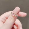 Japanese cute adjustable ring with bow, light luxury style, on index finger