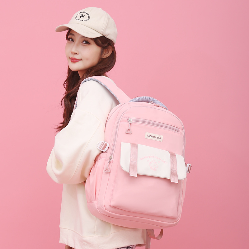 Fábrica al por mayor estudiante de secundaria schoolbag simple moda de gran capacidad impermeable reducción de carga mochila de viaje