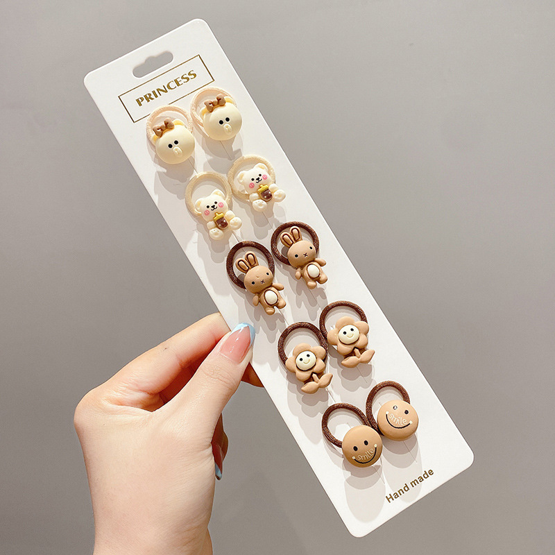 La cuerda del lazo del pelo del bebé la banda del pelo del pulgar de los niños tocado cuerda del pelo del bebé la niña no duele los accesorios del pelo de las muchachas de la banda de goma del pelo