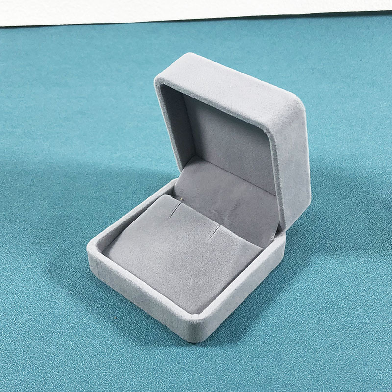 Light gray earring box; rounded velvet box