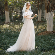 法式輕婚紗2023新款新娘一字肩吊帶小個子蝴蝶結氣質主持禮服拖尾