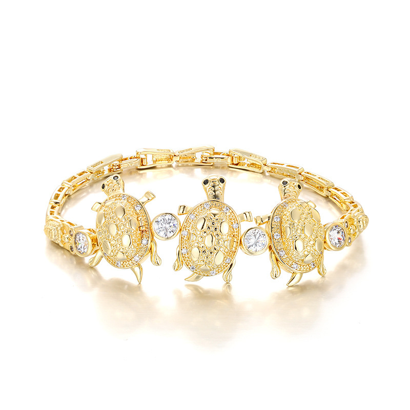 Xuping aleación de cobre chapado 14k comercio exterior transfronterizo de Europa y Estados Unidos incrustado con zircon tres nichos de tortuga pulseras de lujo ligeras