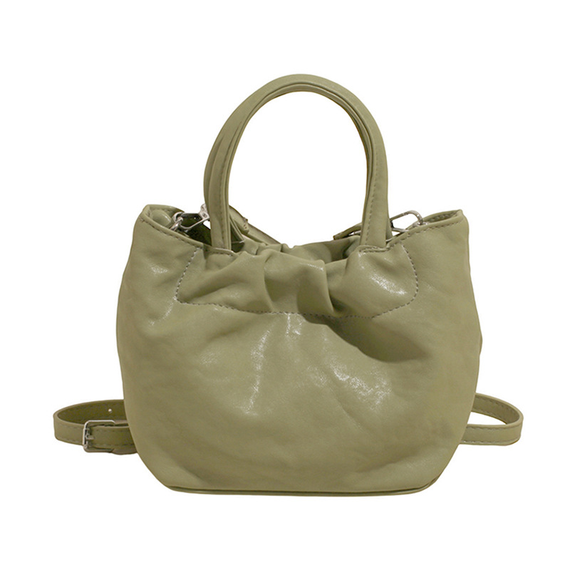 2025 nuevo bolso de cubo portátil de color sólido de diseño de nicho para mujer, bolso de mensajero de un solo hombro simple y moderno de alta gama para mujer