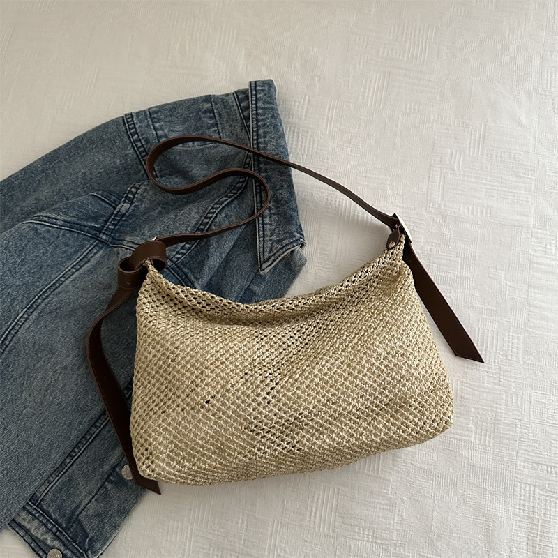 Nicho de alta sensación de bolso de tejido para mujeres 2024 nuevo tipo de viaje al trabajo bolso de paja de hombro de gran capacidad bolso de mochila