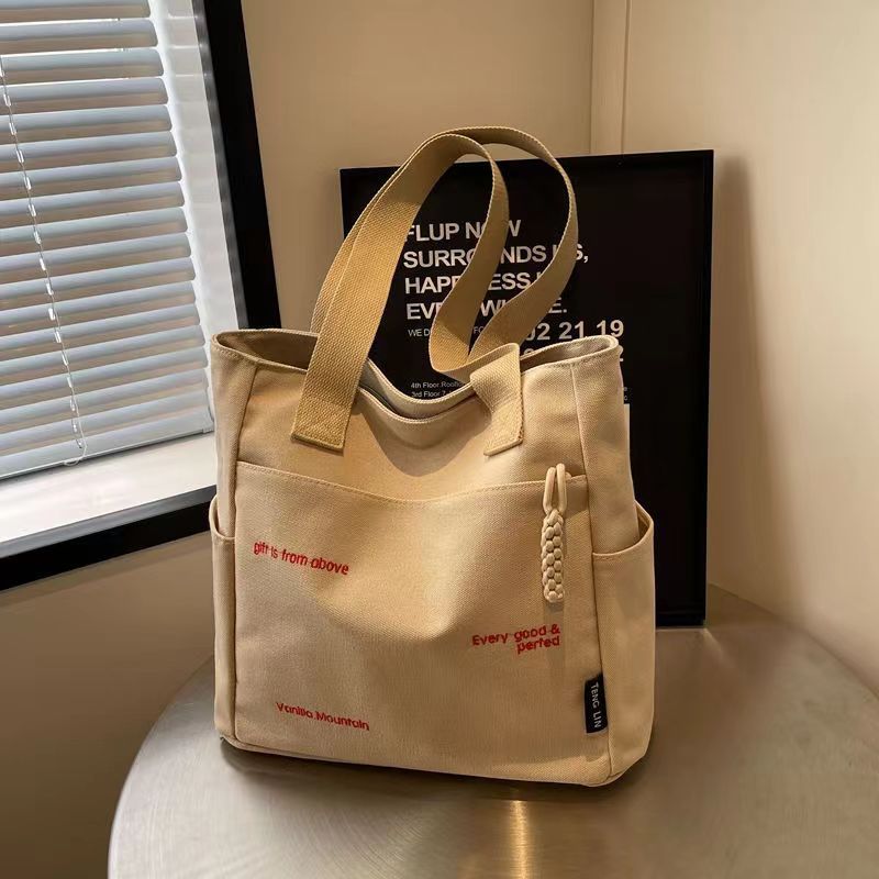 Bolsa de mano ligera para mujeres en clase de hombro único bolso de lienzo con cremallera de estilo coreano