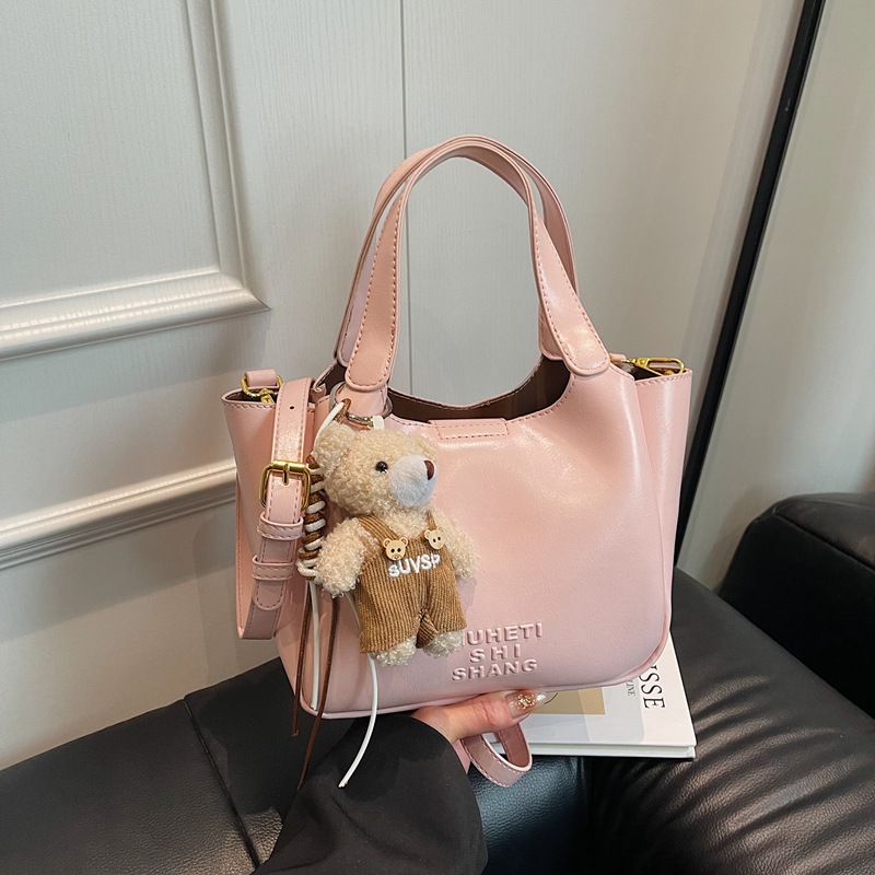 Vintage Maillard bolso de mano para mujeres 2025 nuevo estilo transfronterizo popular aceite cera cuero bolso de cubo textura mochila