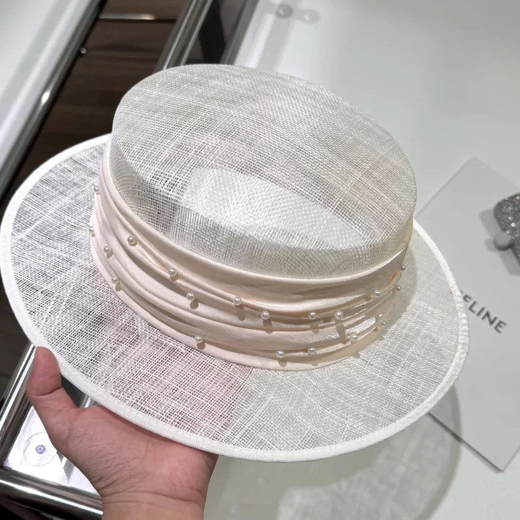 Elegant lady's pearl silk and linen hollow straw hat for women in…