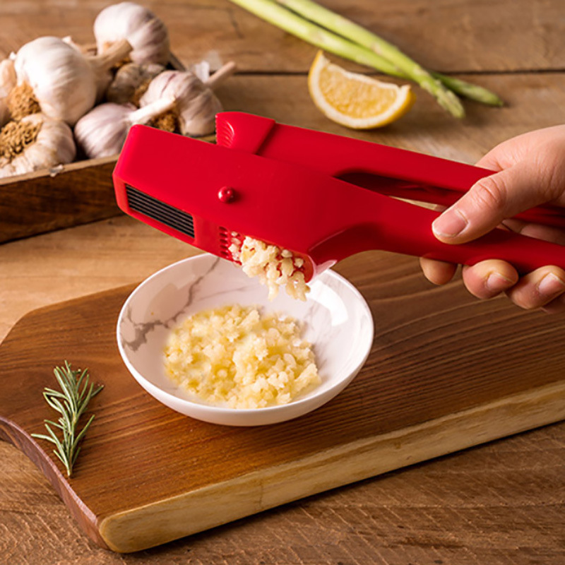 Prensa de ajo manual de plástico de doble propósito dos en uno se puede cortar en rodajas ajo de ajo doméstico artefacto de prensa de ajo