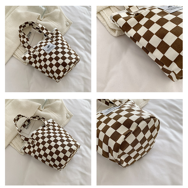 A fashionable new Japanese and Korean chic black and white checkered canvas bag, a large-capacity single-shoulder bag for women, and a simple student handbag undefined