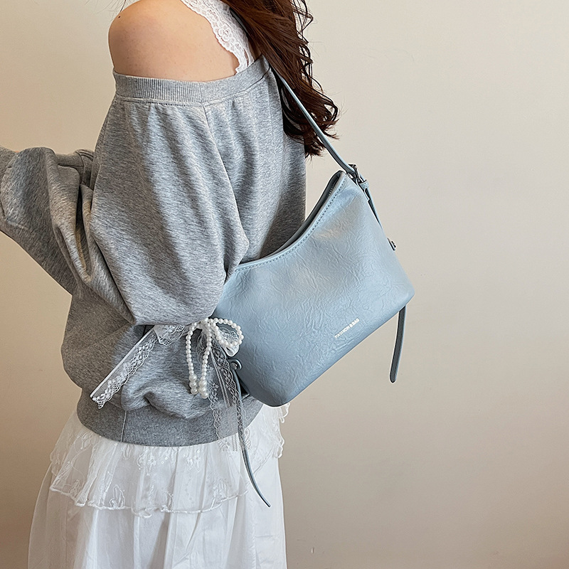 Bolso de axila para mujer 2025 nuevo estilo de alta gama, bolso de hombro de nicho, bolso de mensajero de todo fósforo de cercanías, bolso de cubo popular de este año