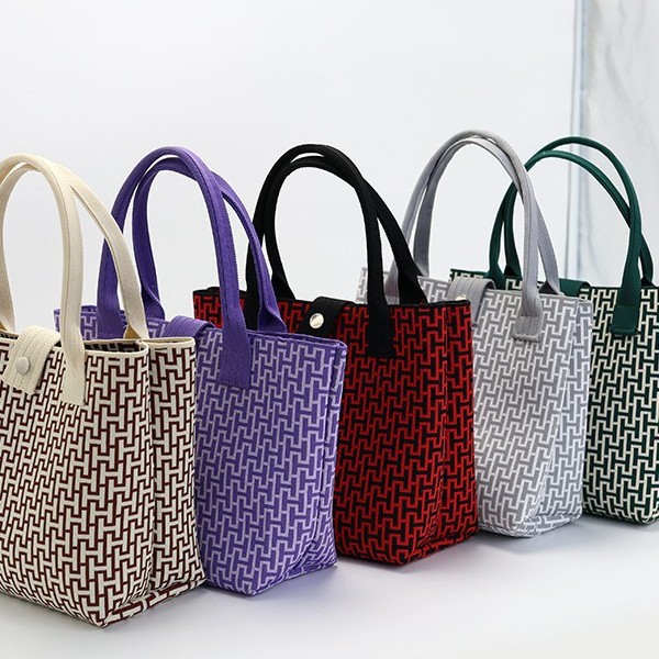 Japón y Corea del Sur tejido bolsas de mano bolsas de viaje de gran capacidad bolsas de compras de chicas fabricantes de bolsas H al por mayor