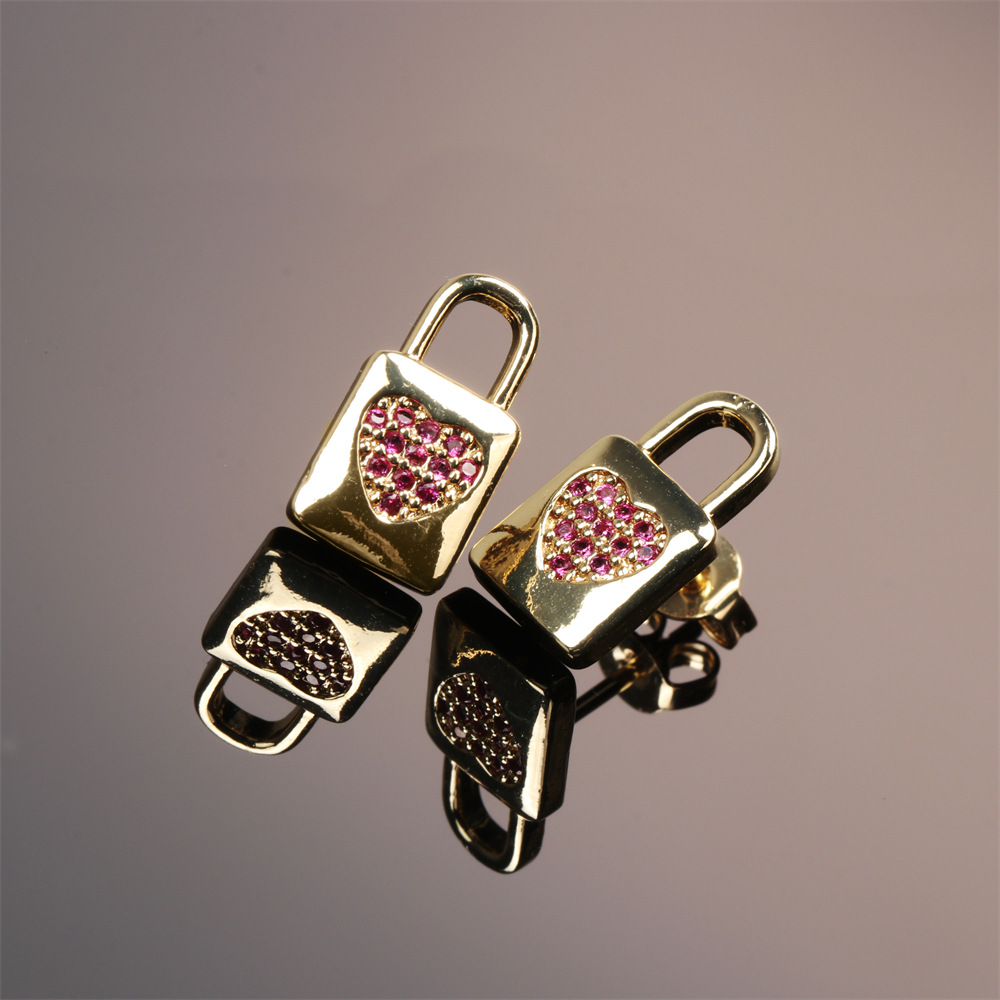 Fashion Copper Inlaid Color Zircon Lock Carved Earrings display picture 2