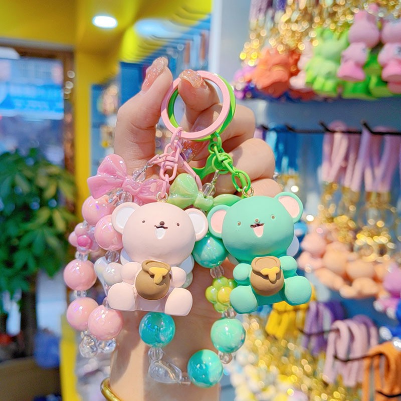 Creativo lindos cuentas miel osos coches mochilas de automóviles para hombres y mujeres parejas pequeños regalos colgantes de llaveras al por mayor