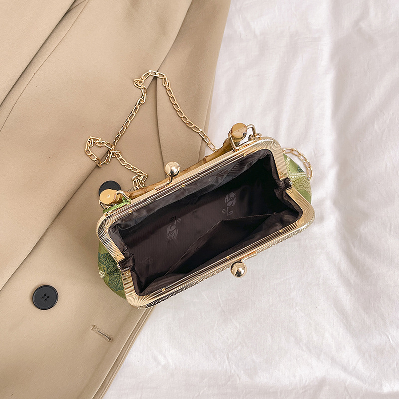 Elegante borsa a secchiello da donna con manico in legno e catena_voghion.com