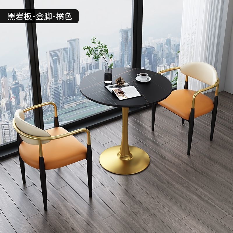 Gold legs + black rock slab + orange leather, one table and two chairs