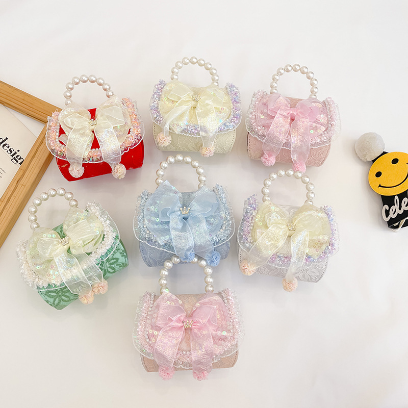 Bolso infantil de perlas 2024 nueva chica arco de moda, bolsa de tramo inclinada, princesa de moda, accesorios de algodón y lino, bolso