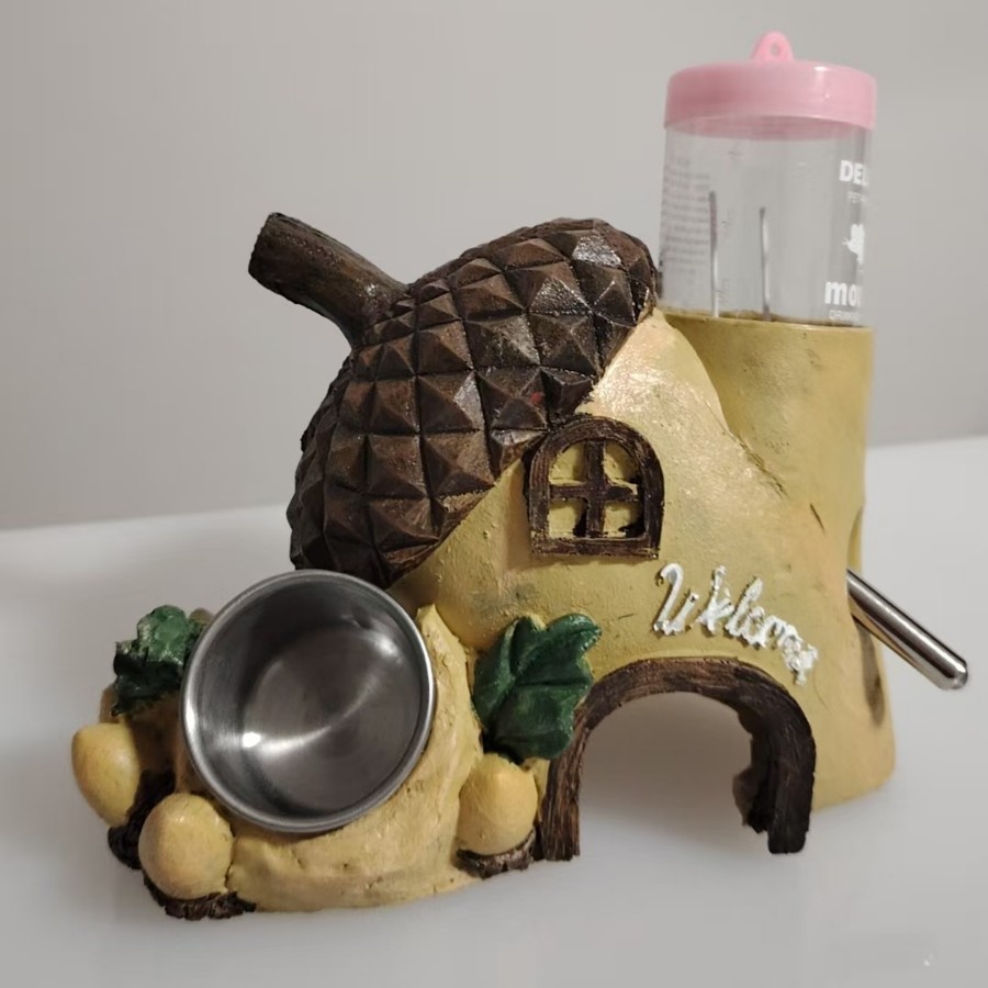 Los fabricantes personalizan muestras de pequeños suministros para mascotas, comederos de hámster, agua para evitar agujeros, casas de piña de frutas, péndulo creativo de dibujos animados