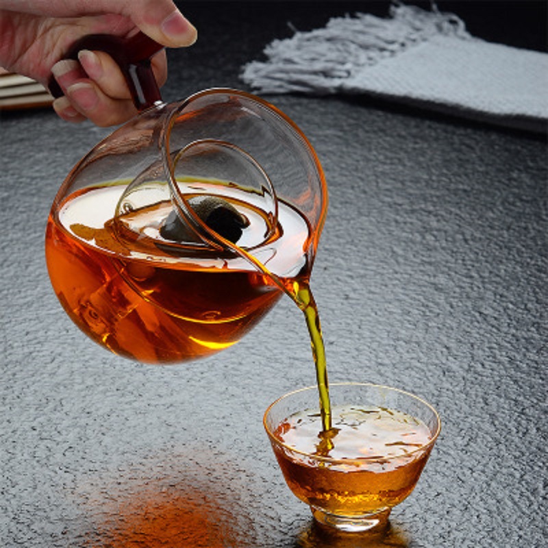 Fábrica al por mayor resistente al calor de alta temperatura de vidrio resistente pequeño verde naranja tetera hirviendo especial tetera Kung Fu taza de té hirviendo