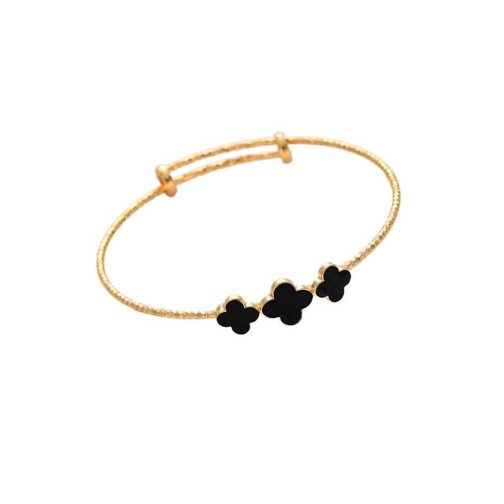Pulsera de trébol de cuatro hojas con goteo de oro champán chapado en cobre, pulsera de personalidad simple para mujer, boca de anillo de mano ajustable, estilo clásico al por mayor