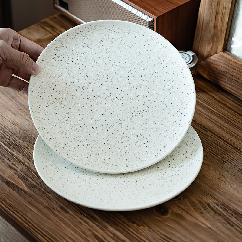 Plato de cerámica esmalte de sésamo retro platos de comedor occidentales platos de cubierta domésticos platos redondos al por mayor platos de postres platos de desayuno platos