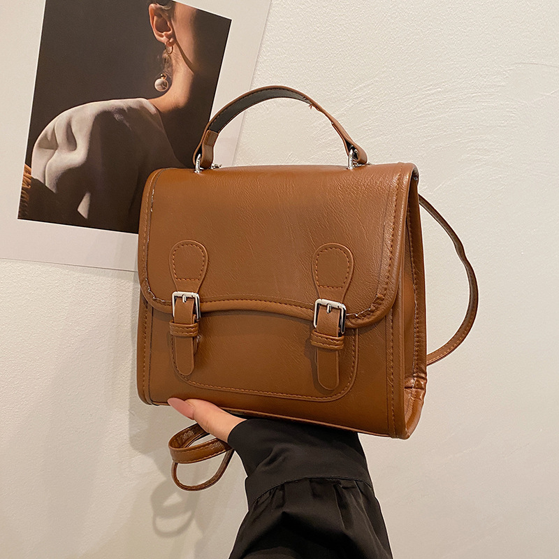 Colegio retro coreano doble hebilla estilo británico 2024 literatura y arte ocio de gran capacidad de moda textura mochila de hombro