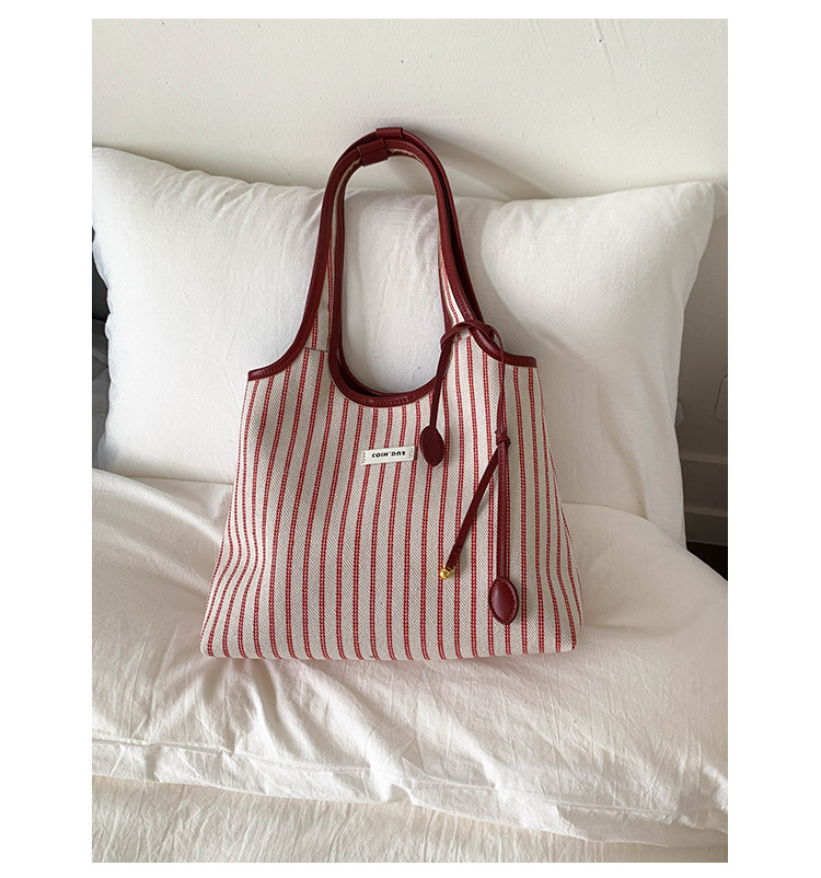 2025 Casual Commuter Tote bag, women's niche striped simple and fashionable hand-held shoulder bag, large-capacity underarm bag undefined