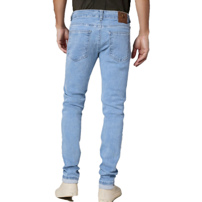 Jeans da uomo slim fit elasticizzati strappati, azzurri, affusolati, modello a gamba dritta._voghion.com