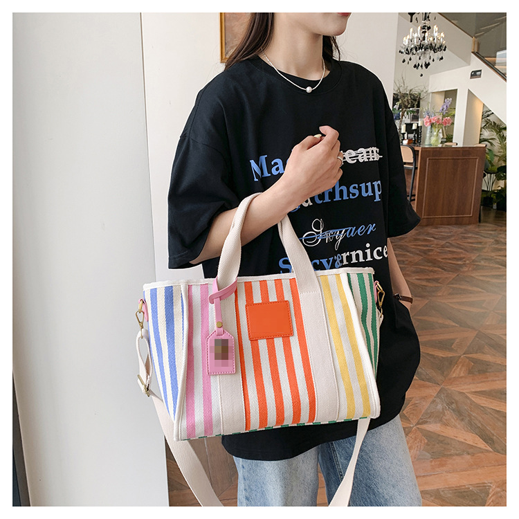 Bolso grande de cercanías para mujer, nuevo estilo de primavera, bolso de lona de viaje y vacaciones, bolso de cabeza de águila personalizado, bolso de mujer portátil de todo fósforo