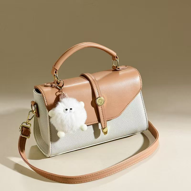 Muñeca colgante bolso mujer mujer 2025 nuevo bolso cuadrado pequeño moda todo-fósforo bolso de mensajero de un solo hombro bolsas transfronterizas
