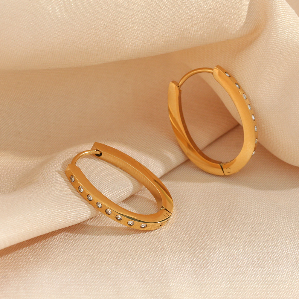 Title 1, Orecchini ovali da donna in acciaio inox con zi...