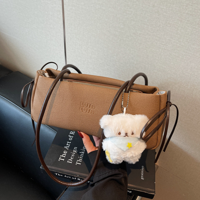 Nicho francés de viaje bolso de hombro bajo la axila para mujeres 2025 nuevo bolso de mano de alto nivel retro versátil bolso de palo