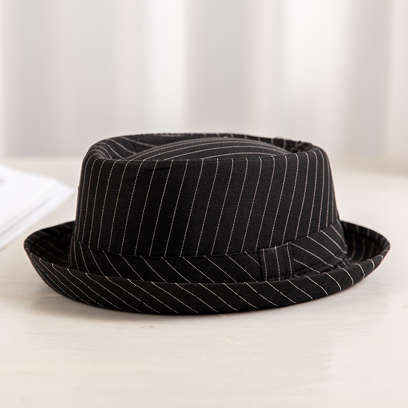 Sombrero de los hombres de primavera y verano británico europeo y americano de moda sombrero de copa a cuadros en blanco y negro a prueba de sol transpirable Jazz sombrero fábrica al por mayor