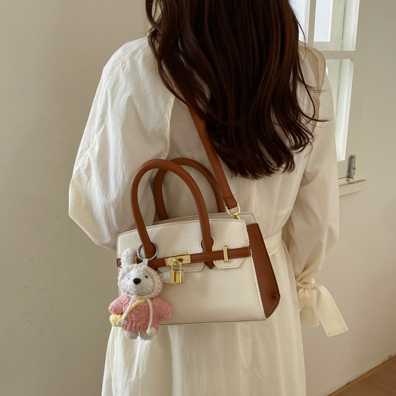 Coreano simple bolso de mano mujer 2026 primavera nueva bolsa de viaje diario texturizada bolso de mochila
