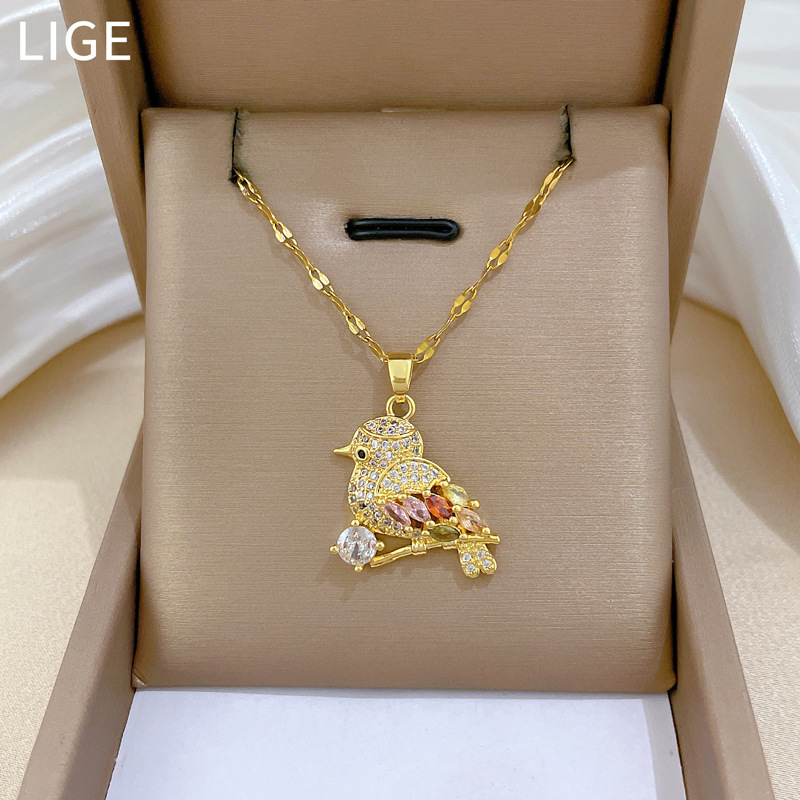 Collana con ciondolo a forma di uccello e zirconi oro_voghion.com