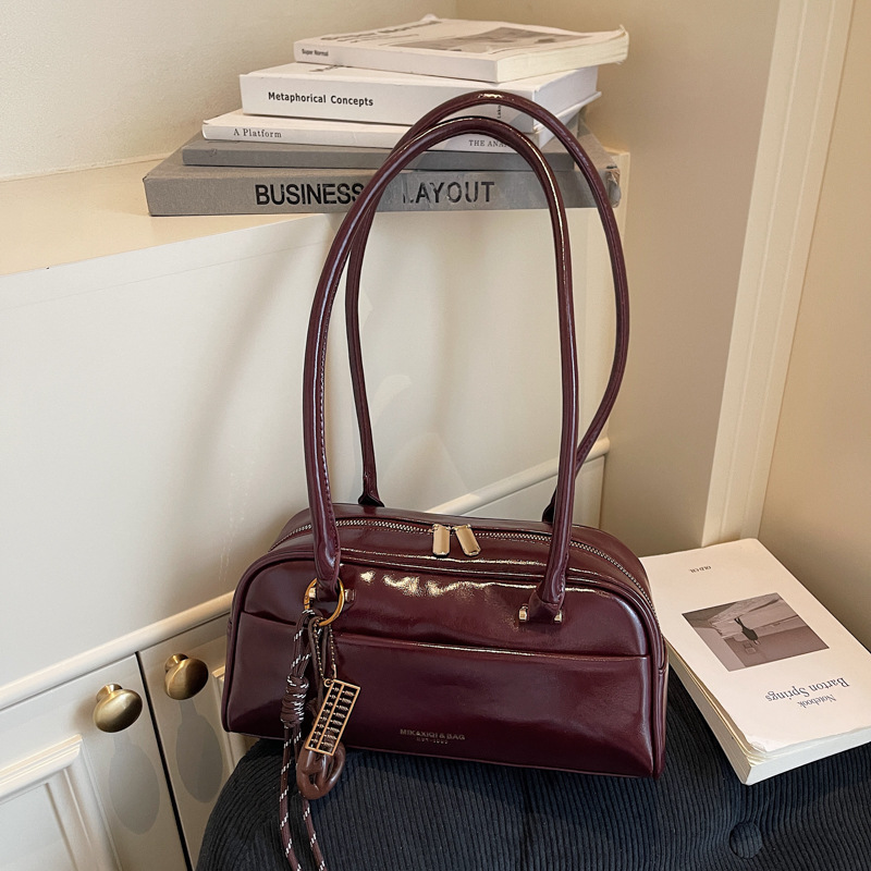 Bolsa de almohada retro para mujeres invierno 2025 nueva alta sensación de cuero suave bolsa de hombro bajo la axila bolsa de bolos de mano de moda