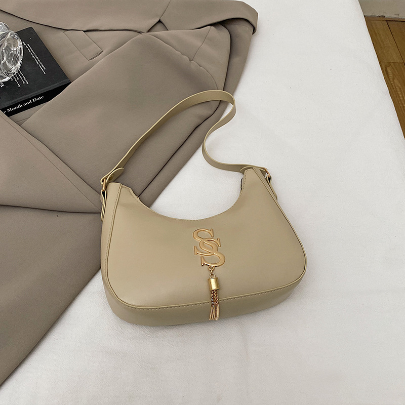 Bolso de hombro retro coreano primavera / verano 2024 nueva moda bolso de hombro de moda bolso de media luna de mujer