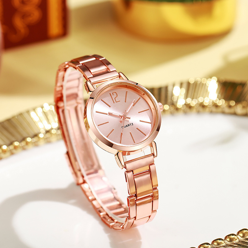 Nueva correa de acero de comercio exterior para mujer, moda simple, redonda, correa de acero pequeña de oro, reloj de cuarzo, reloj de moda para estudiantes de mujer