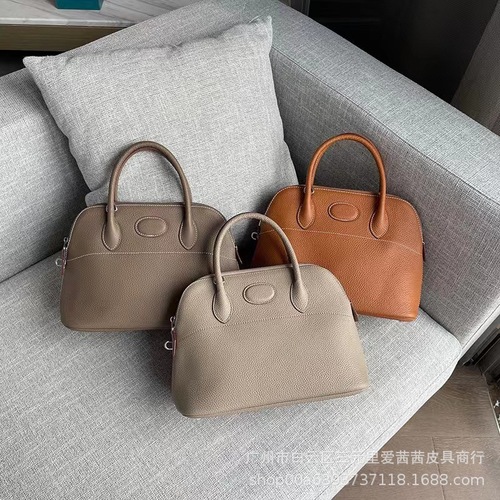 New Arrival Litchi-Grain Genuine Leather Bowling Ball Shell Bag  
Premium Full-Grain Cowhide Tote with Zipper Closure  
Spacious Casual Women's Handbag