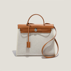 New niche herbag Kelly bag canvas shoulder portable crossbody bag high-end commuter tote genuine leather women's bag